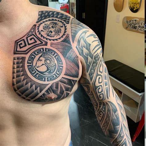 male half chest tattoos|pectoral tattoos.